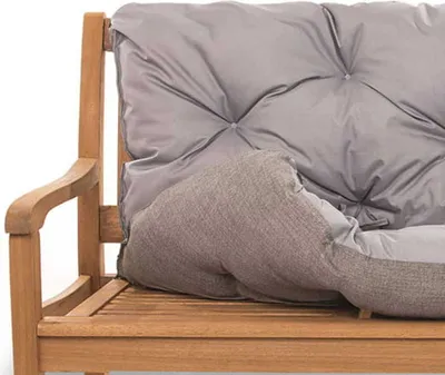 A close-up view of a gray cushion on a wooden garden bench.