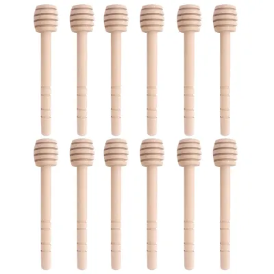 A collection of wooden honey dippers arranged in a grid.