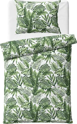A bedding set with a jungle leaf pattern on a white background.