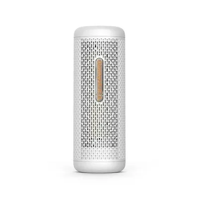 A small white dehumidifier with a brown indicator strip.