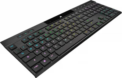 A black mechanical keyboard with RGB lighting is shown from a diagonal angle against a white background.