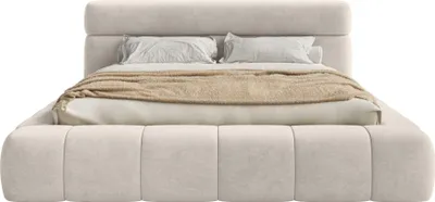 A bed with pillows and a blanket on a white background.