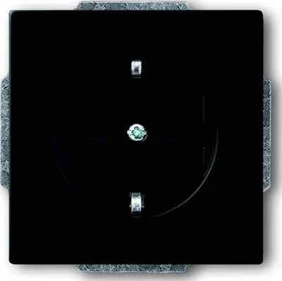 A black electrical outlet with a gray frame.