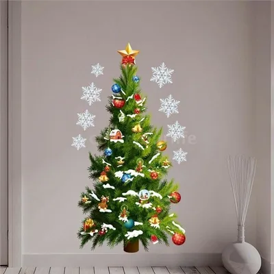 A decorated Christmas tree sticker on a wall, surrounded by snowflake stickers.