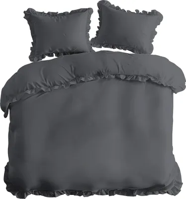 A duvet cover and two pillowcases with ruffles, laid out on a white background.