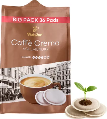 A package of Tchibo coffee pads with a cup of coffee and coffee pads shown, and a small plant growing from coffee pads on the right.