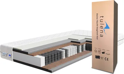 A cutaway view of a mattress showing its internal structure, with its packaging box to the right.