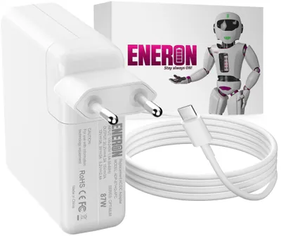 A white USB-C power adapter and cable are displayed with a box in the background.