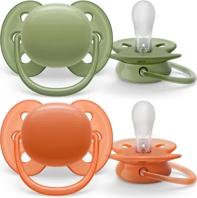 Two pairs of baby pacifiers, one green and one orange, displayed against a white background.