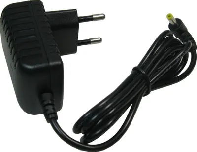 A black power adapter with a European plug and a coiled black cable with a yellow-tipped connector.