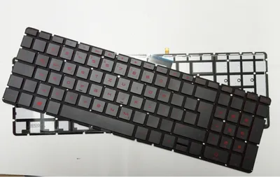 A black laptop keyboard with red lettering is shown from a slightly elevated, diagonal angle.