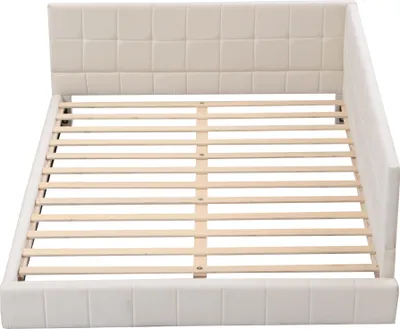 A beige upholstered bed frame with a slatted wooden base, shown from a diagonal angle.