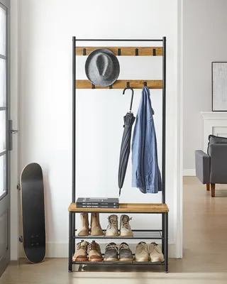 An entryway with a coat rack and shoe storage.