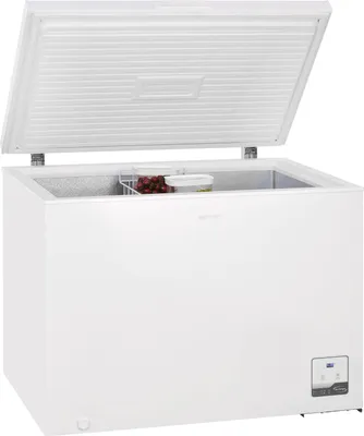 A white chest freezer with the lid open, showing a small basket of grapes and a container inside.