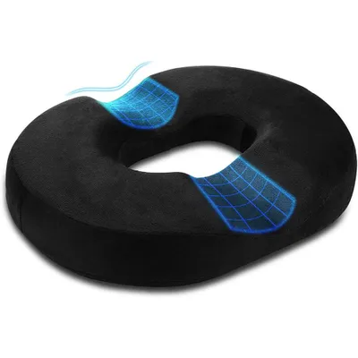 A black donut-shaped seat cushion with blue grid overlays indicating airflow or support.