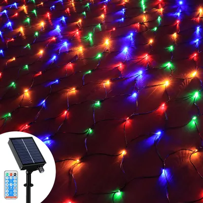 A close-up view of a net of colorful LED lights, with a solar panel and remote control in the bottom left corner.