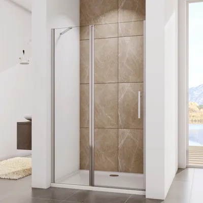 A modern bathroom with a shower enclosure, featuring tiled walls and a view of mountains and a lake through a window.