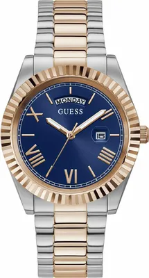 A close-up studio shot of a men's watch with a blue dial, silver and rose gold band, and a fluted bezel.
