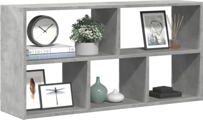A gray cube shelf unit with various decorative items placed inside.