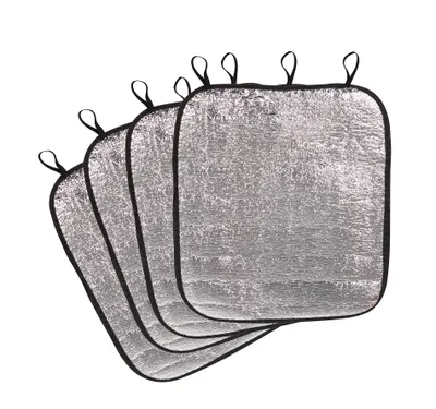 A stack of four silver seat cushions with black trim and loops on top, isolated on a white background.