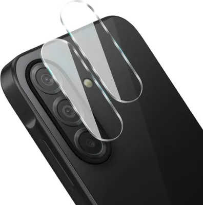 A close-up view of two clear camera lens protectors being placed on the camera module of a black smartphone.
