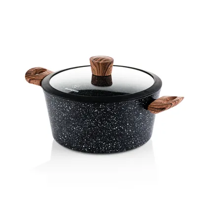 A black speckled pot with a glass lid and wooden handles and knob, set against a white background.