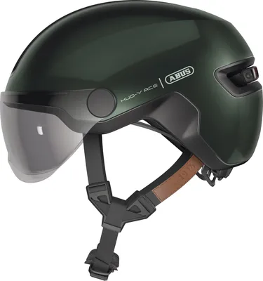 A studio shot of a green bicycle helmet with a visor and straps.