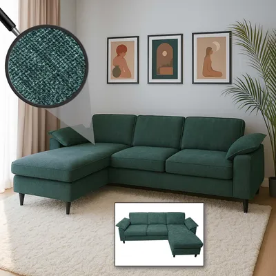A sectional sofa in a living room setting with artwork on the wall and a plant.