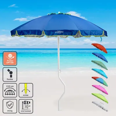A blue beach umbrella on a sandy beach with the ocean in the background. Several other colored umbrellas are displayed to the right.