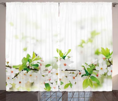 White curtains with a pattern of white cherry blossoms and green leaves.