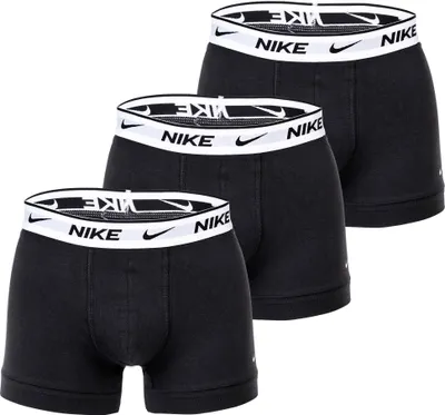 Three black Nike boxer briefs are arranged in a staggered formation against a white background.