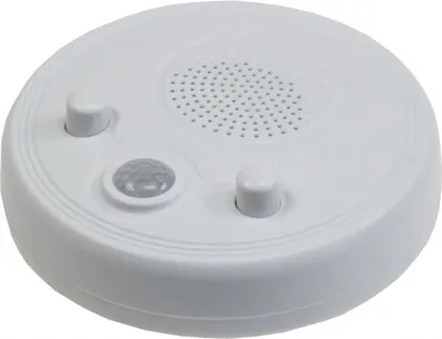 A white, circular radio with a motion sensor and two knobs is shown from a top-down angle against a white background.