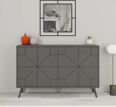 A modern gray sideboard with geometric patterns on its doors, placed against a light gray wall. Decorative items and a mirror are on top.