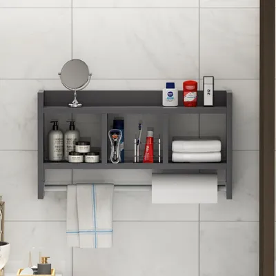 A bathroom shelf with various toiletries and towels.