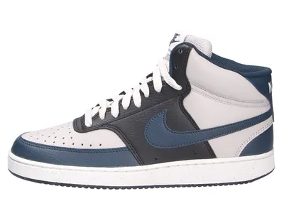 A side view of a Nike Court Vision Mid NN sneaker.