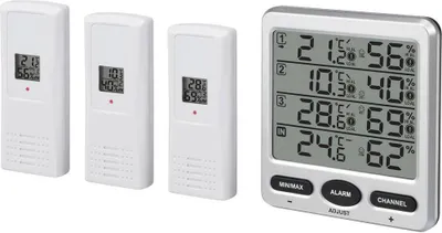 A digital thermometer and three remote sensors are displayed on a white background.