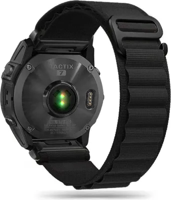 The back of a black smartwatch with a fabric strap.
