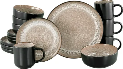 A collection of stoneware dinnerware, including plates, bowls, and mugs, arranged on a white background.