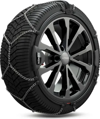 A close-up studio shot of a car tire with snow chains installed.