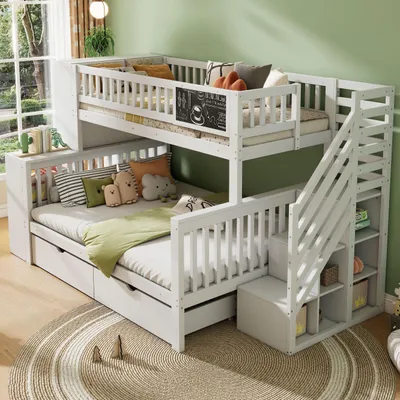 A white bunk bed with stairs, drawers, and shelves, decorated with pillows and a blanket, set in a room with a green wall and a window view.