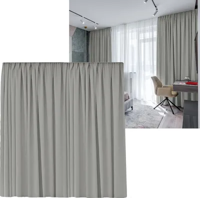A close-up of a light gray curtain with pleats, with a room scene in the background.
