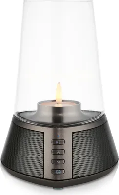 A product shot of a Bluetooth speaker with a candle-like light.