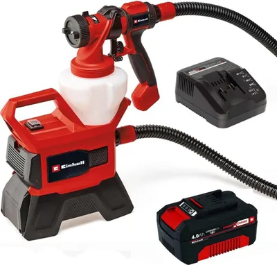 A red and black Einhell cordless paint spray system with a battery and charger, displayed against a white background.
