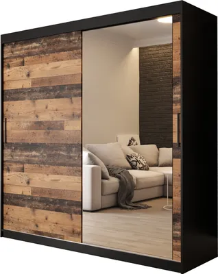 A sliding door wardrobe with a mirrored door and a wood-effect panel, reflecting a living room scene.