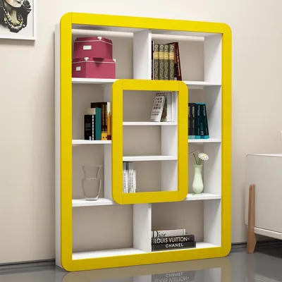 A modern white bookshelf with a yellow frame, featuring various items on its shelves.
