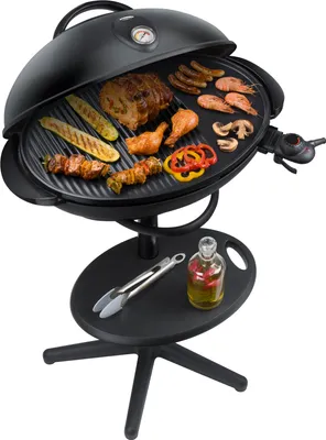 A black electric grill with food on it, placed on a stand with a small shelf.