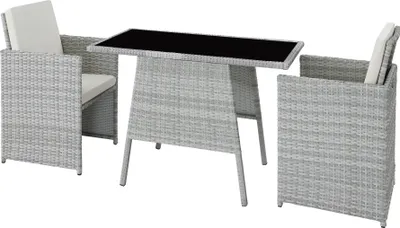 A rattan dining set with two chairs and a table on a white background.