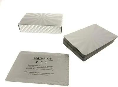 A set of playing cards with a certificate of ownership, presented on a white background.