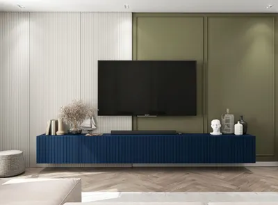 A modern living room with a TV stand and mounted television.