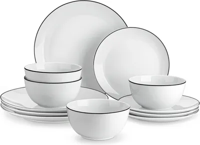 A set of white porcelain plates and bowls with a thin black rim, arranged on a white background.